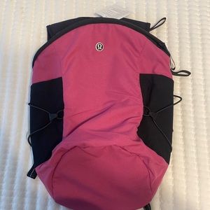 New with Tags Lululemon Run All Day Backpack II.  Pink fuchsia color.